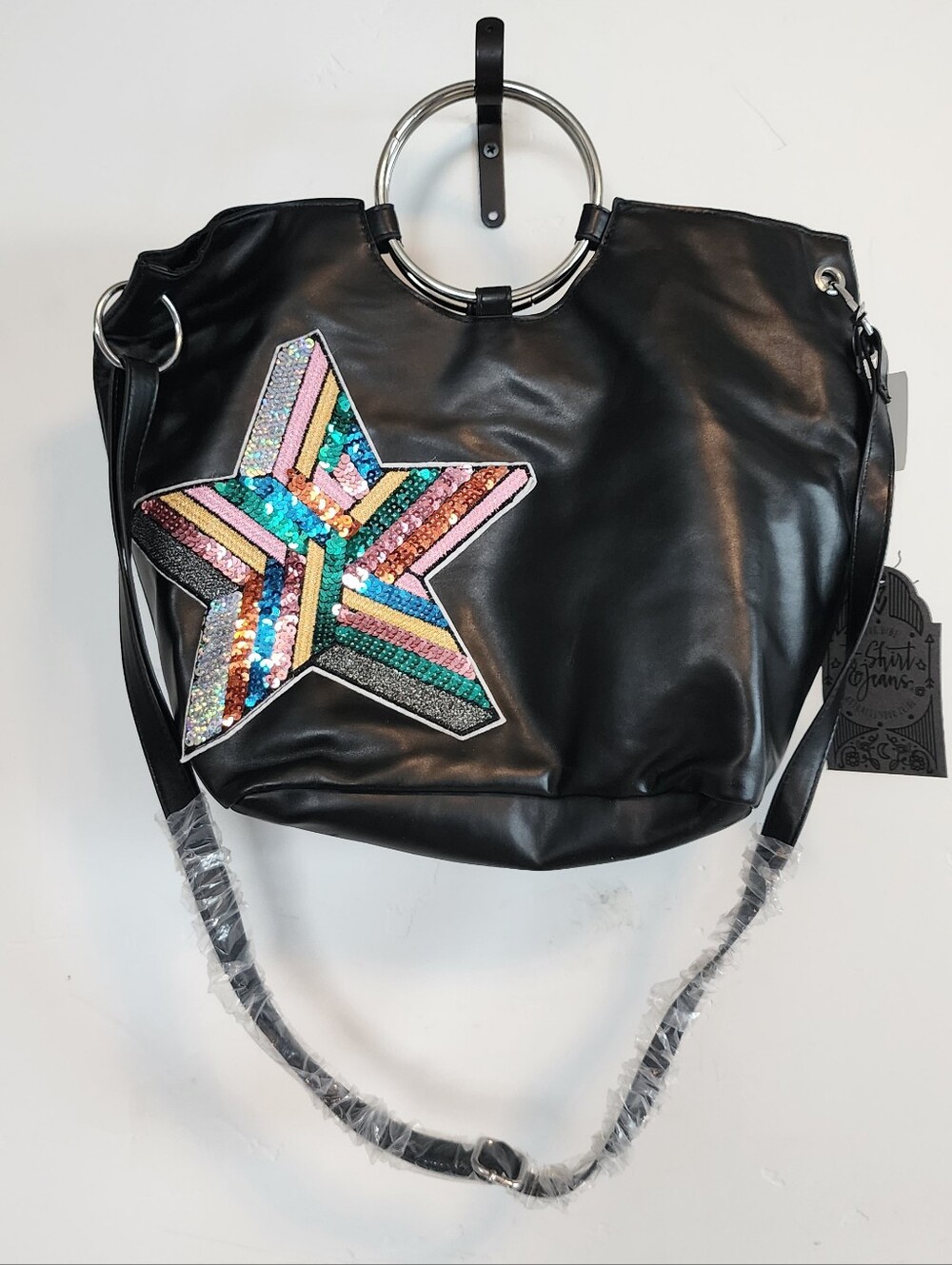 Black sequin star shoulder tote with silver ring handles